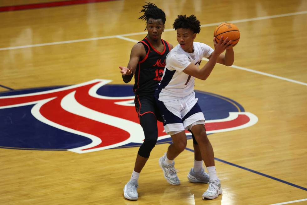 Coronado's Sebastian Mack (12) defends against Liberty's Dedan Thomas (11) during a boys class ...