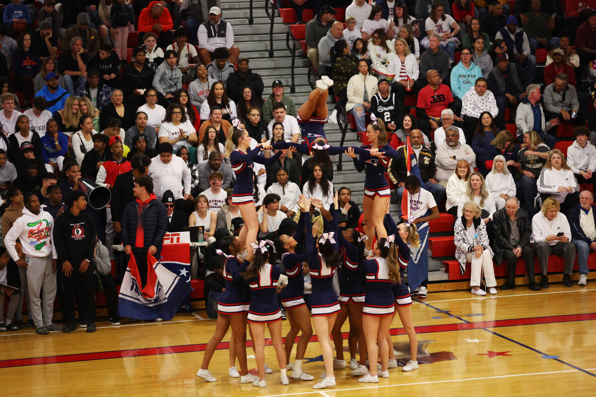Cheerleaders perform during a boys class 5A southern region semifinal game between Liberty and ...