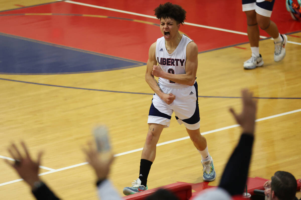 Liberty's Maleek Simeus (2) reacts after scoring a 3-point-shot against Coronado during a boys ...