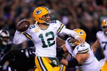 Green Bay Packers quarterback Aaron Rodgers throws during the first half of an NFL football gam ...