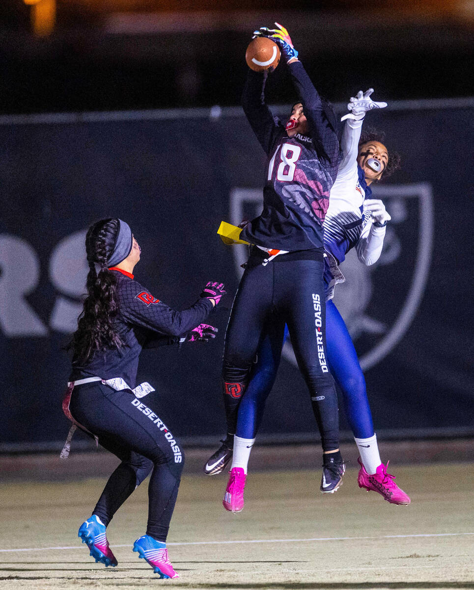 Desert Oasis' Makena Siaki (18) intercepts a pass in the end zone over Legacy's Amaya Stepp (7) ...