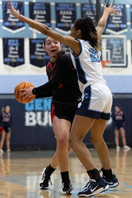 Coronado’s Ashtyn Wick (22) attempts to pass around Centennial’s CiCi Ajomale (21) during a ...