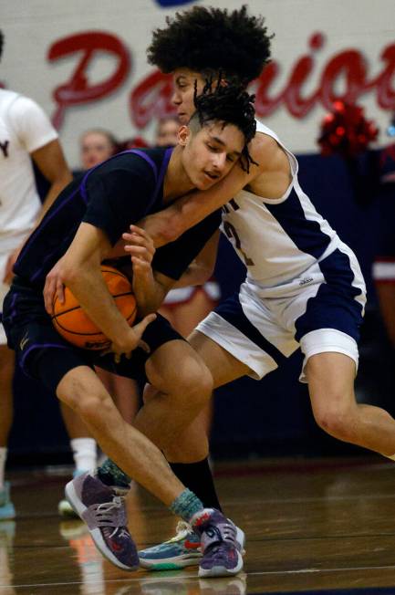 Durango's Mason Brown (2), left, keeps a ball away from Liberty's Angelo Kambala (2) during the ...