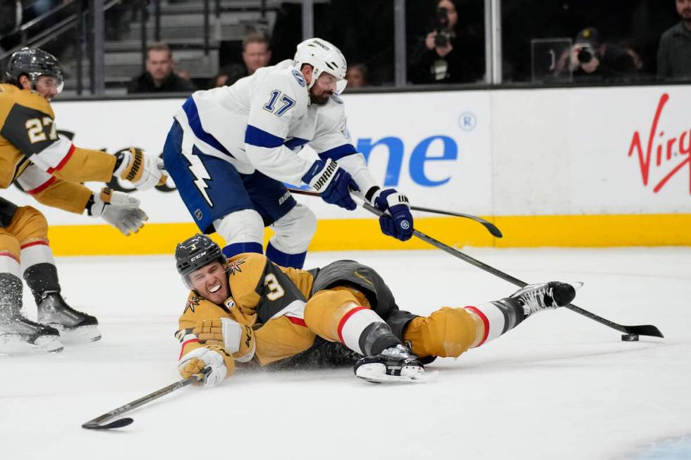 Vegas Golden Knights defenseman Brayden McNabb (3) knocks the puck away from Tampa Bay Lightnin ...