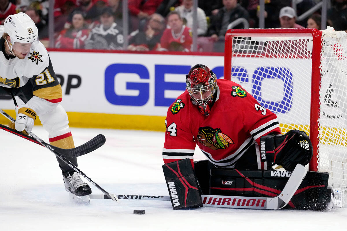 Chicago Blackhawks goaltender Petr Mrazek, right, saves a shot by Vegas Golden Knights center B ...