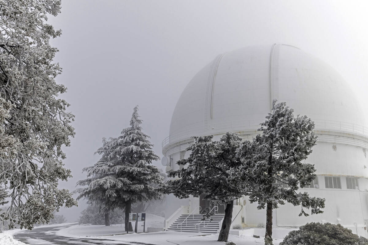 A layer of snow and ice is seen outside the 120-inch telescope observation tower at Lick Observ ...