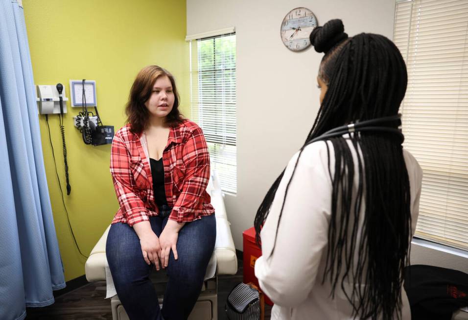 Lilnetra Grady, chief medical fficer at FirstMed Health and Wellness Center, right, talks with ...