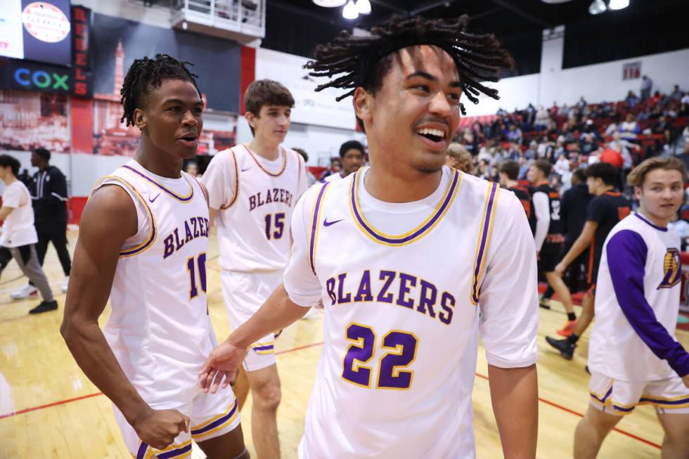 Durango's Tylen Riley (10), left, and Michael Bartlett (22) celebrate their win against Douglas ...