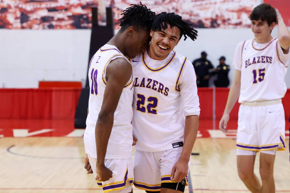 Durango's Tylen Riley (10), left, and Michael Bartlett (22) celebrate their win against Douglas ...