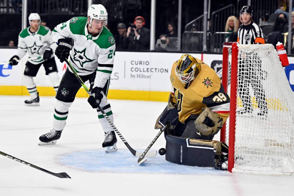 Vegas Golden Knights goaltender Laurent Brossoit (39) blocks a shot by Dallas Stars center Roop ...