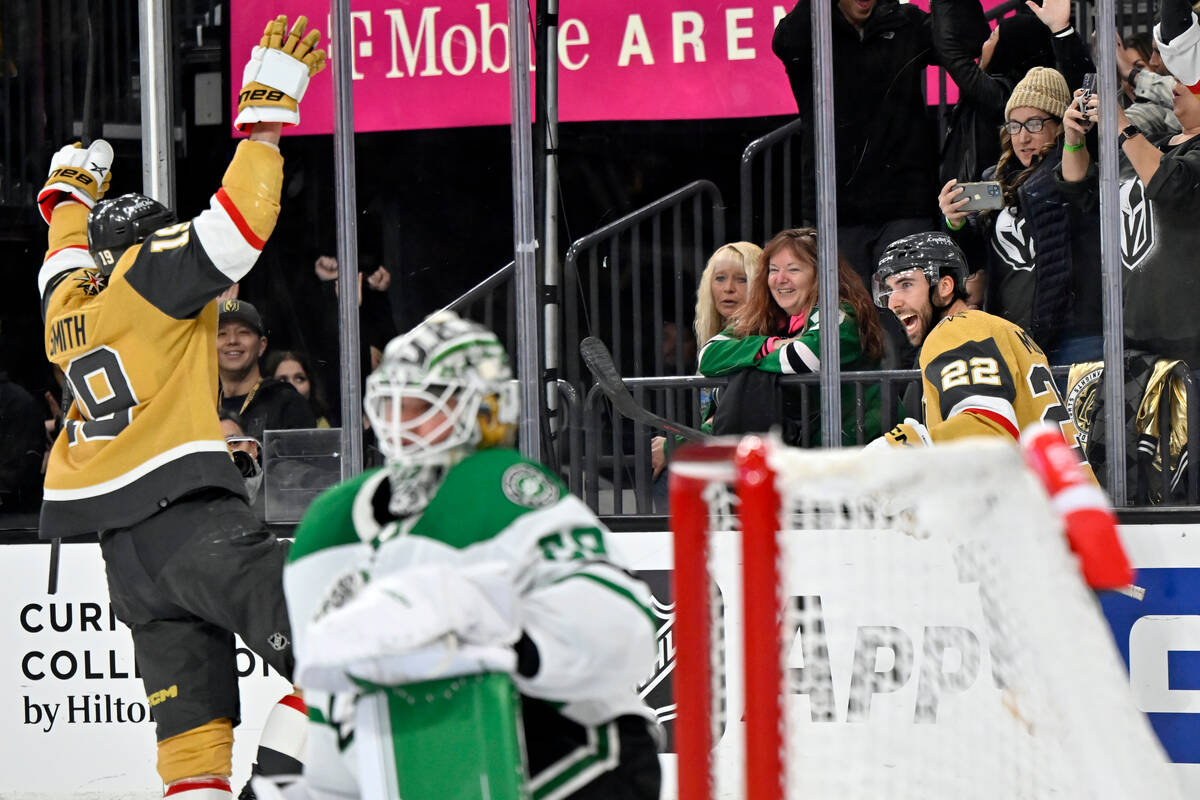 Vegas Golden Knights right wing Reilly Smith (19) and right wing Michael Amadio (22) celebrate ...