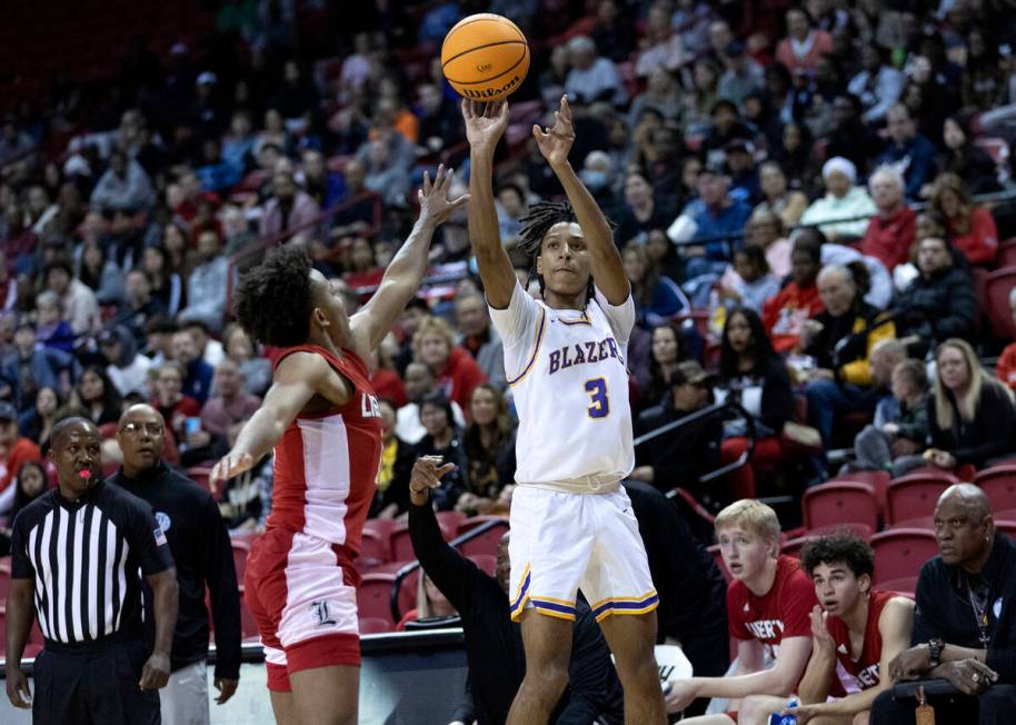 Durango’s Jevon Yapi (3) shoots against Liberty’s Dedan Thomas (11) during the fi ...