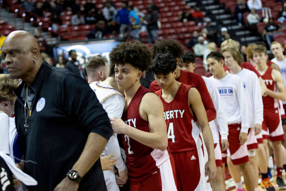Liberty shakes hands with Durango after losing to them in the Class 5A boys high school basketb ...