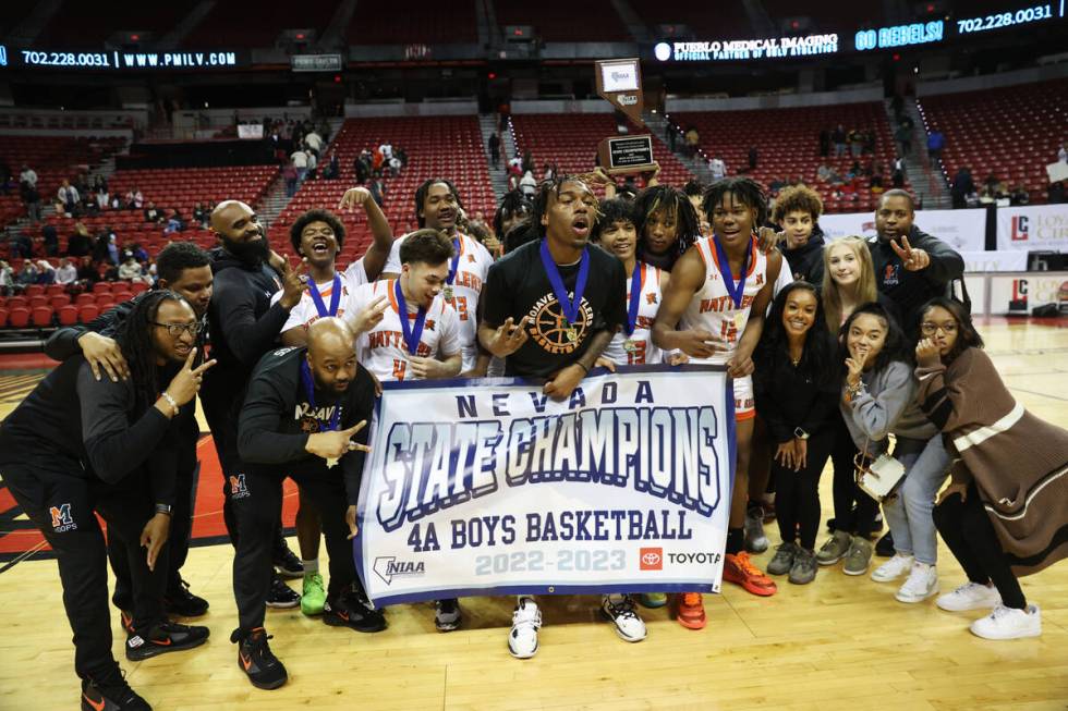 Mojave poses for photos after defeating Silverado in the class 4A boys high school basketball s ...