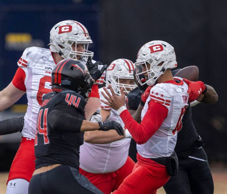 DC Defenders quarterback Jordan Ta’amu (10) fumbles the football during the first half o ...