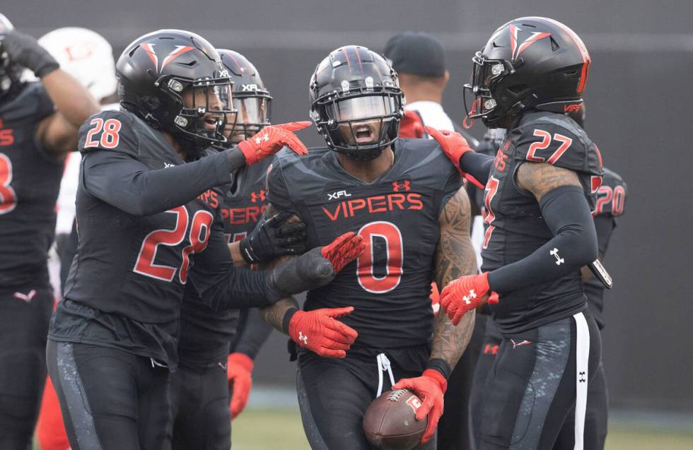 Vegas Vipers linebacker Pita Taumoepenu celebrates his fumble recovery against DC Defenders wit ...