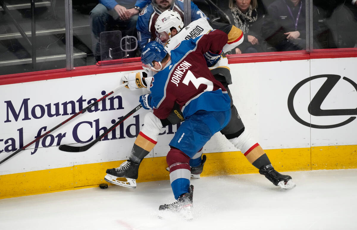 Colorado Avalanche defenseman Jack Johnson (3) pins Vegas Golden Knights right wing Michael Ama ...