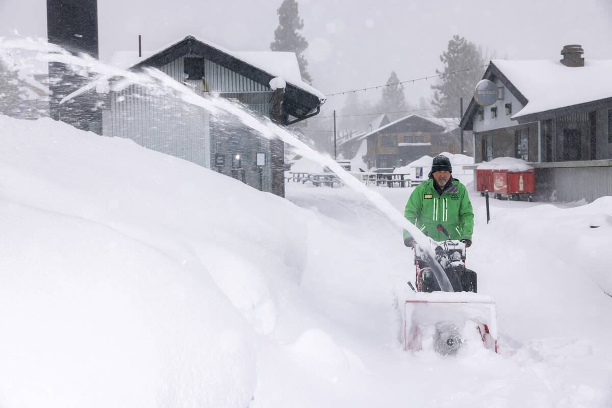 In this photo provided by Big Bear Mountain Resort, snow is removed at the resort in Big Bear, ...