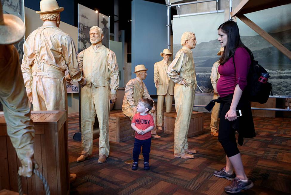 Katie Breuer and her 2-year-old son Jack visit Land Auction display at Origen Museum at the Spr ...