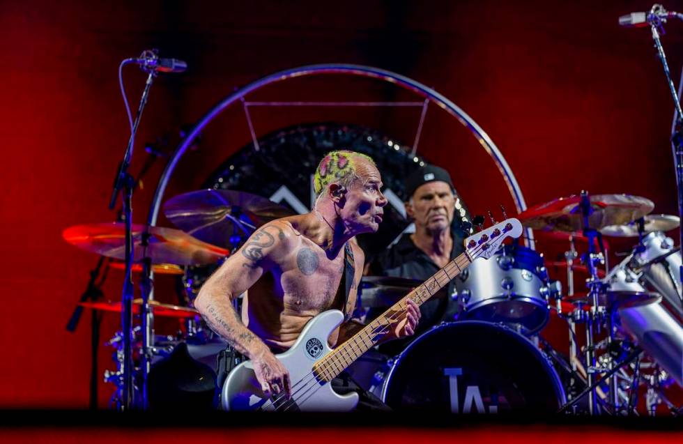 Bassist Flea and drummer Chad Smith perform with The Red Hot Chili Peppers at Allegiant Stadium ...