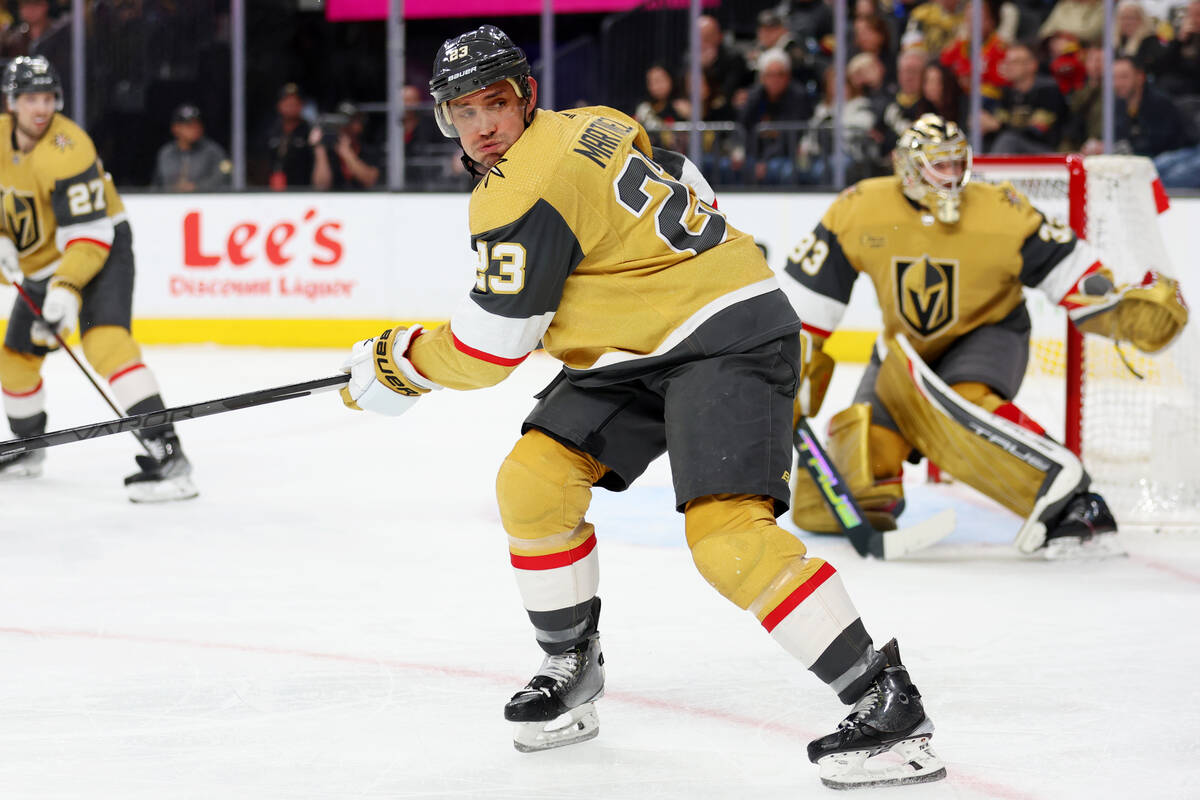 Vegas Golden Knights defenseman Alec Martinez (23) defends against the New Jersey Devils during ...