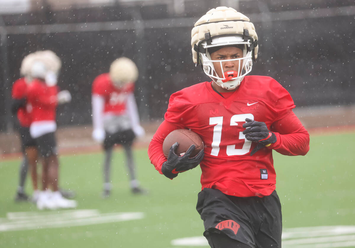 UNLV wide receiver Deamikkio Nathan II (13) runs the ball after a reception during the first da ...