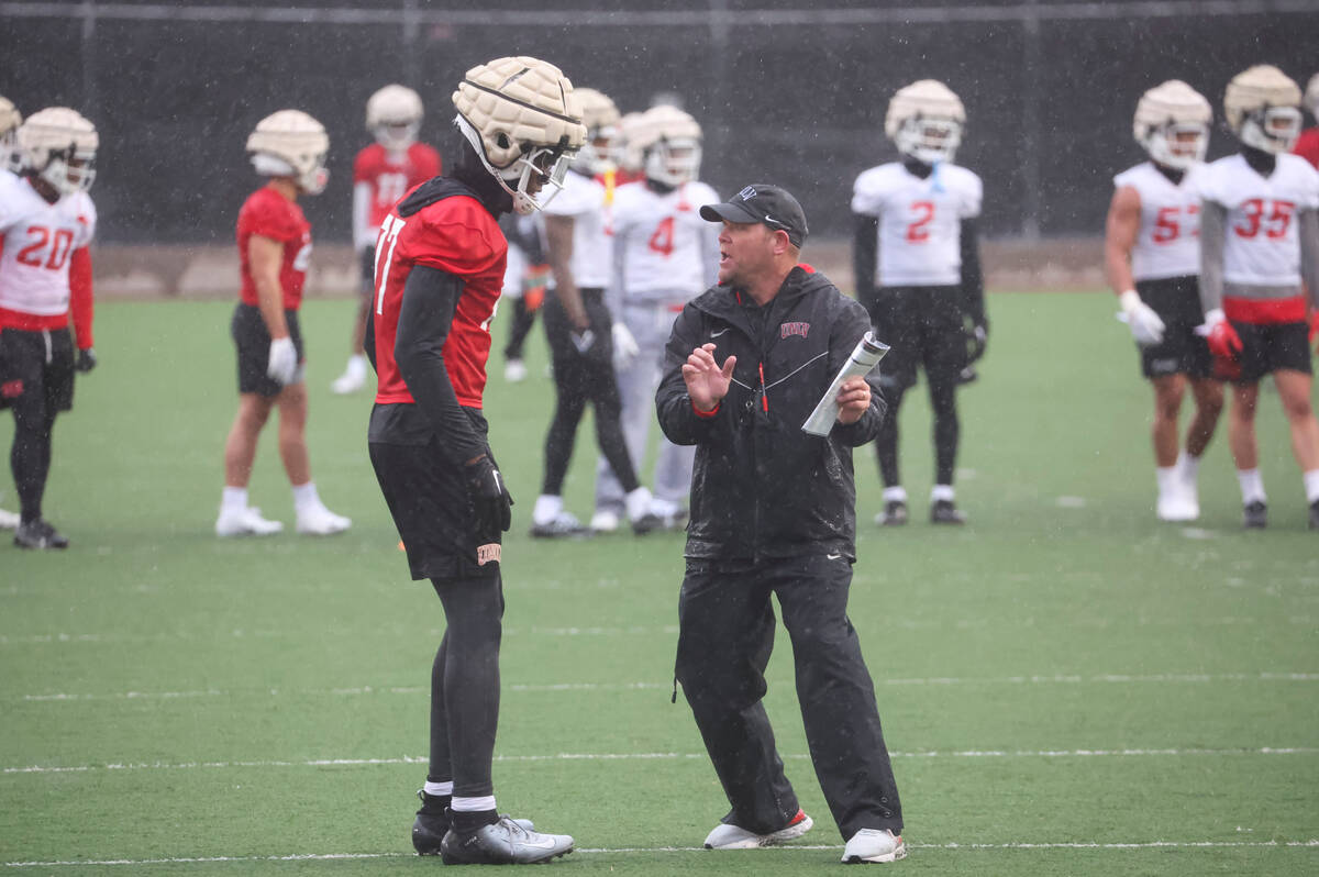 UNLV wide receiver Jordan Jakes talks with UNLV head coach Barry Odom during the first day of s ...