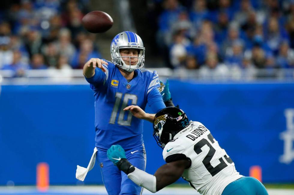 Detroit Lions quarterback Jared Goff (16) is pressured by Jacksonville Jaguars linebacker Foyes ...