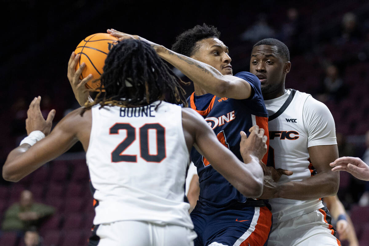 Pepperdine forward Maxwell Lewis (24), who is from Las Vegas, looks to pass while Pacific&#x201 ...