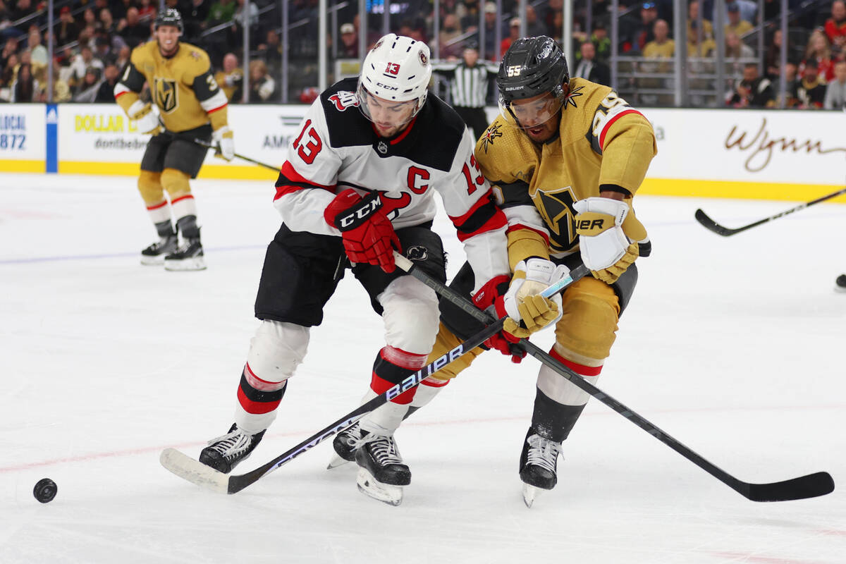 New Jersey Devils center Nico Hischier (13) and Vegas Golden Knights right wing Keegan Kolesar ...