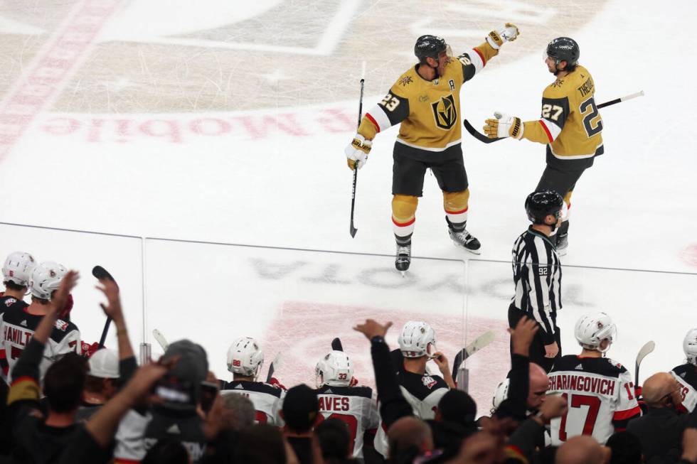 Vegas Golden Knights defenseman Shea Theodore (27) celebrates his game winning shootout goal wi ...