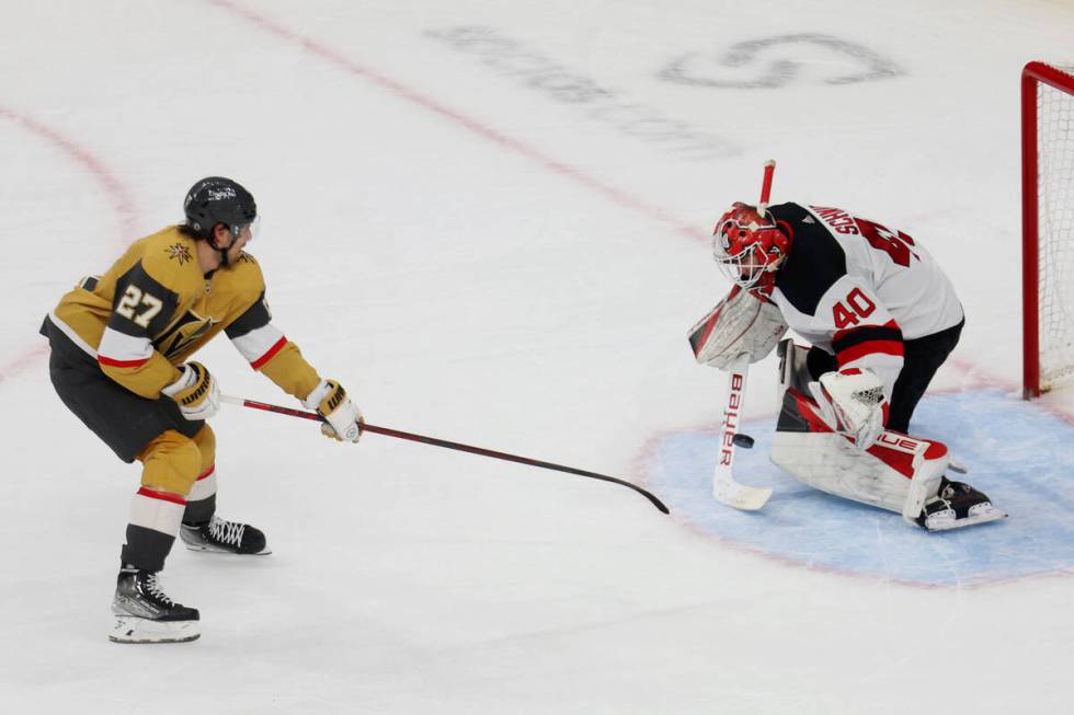 Vegas Golden Knights defenseman Shea Theodore (27) shoots the puck for a score against New ...