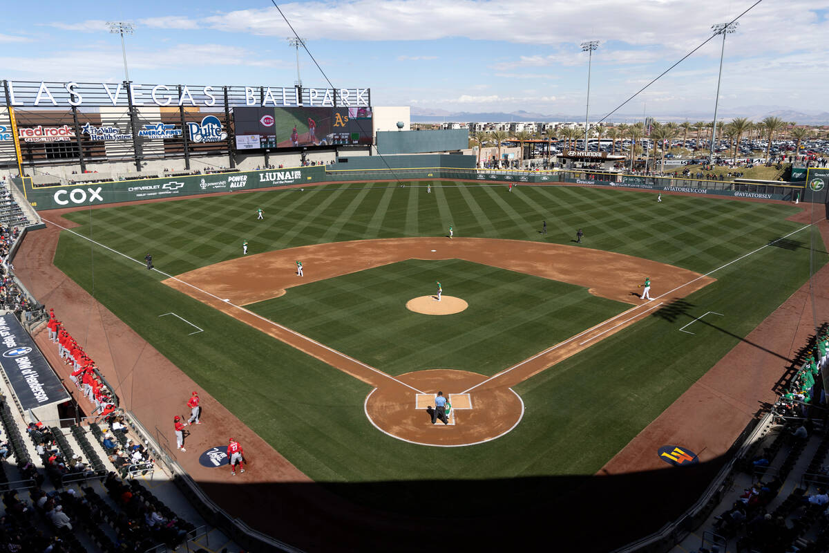 The Oakland Athletics warm up before an MLB exhibition game against the Cincinnati Reds at the ...