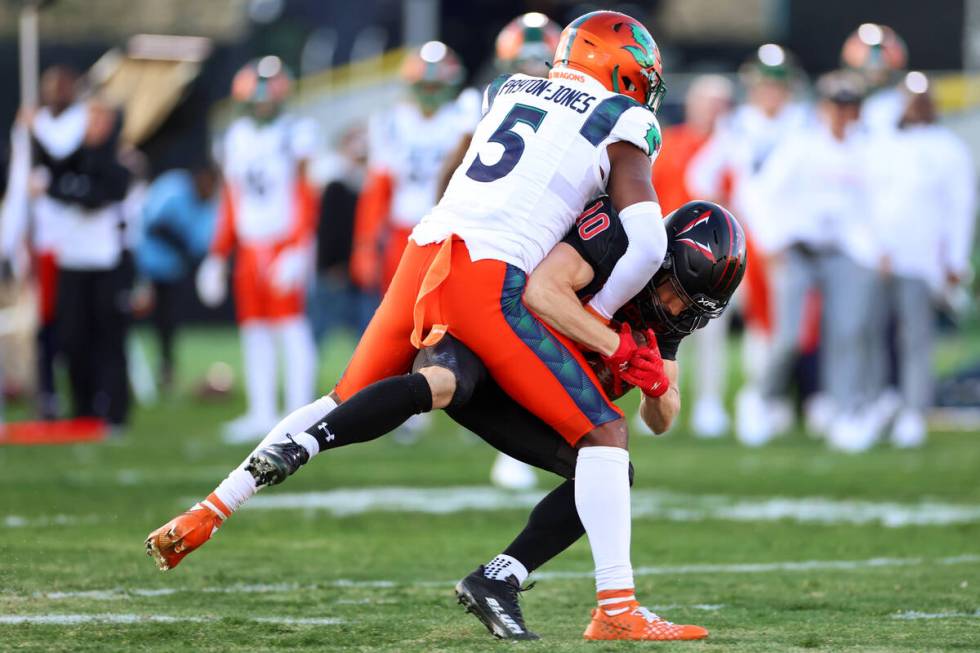 Vegas Vipers wide receiver Mathew Sexton (10) is tackled by Seattle Sea Dragons cornerback Chri ...