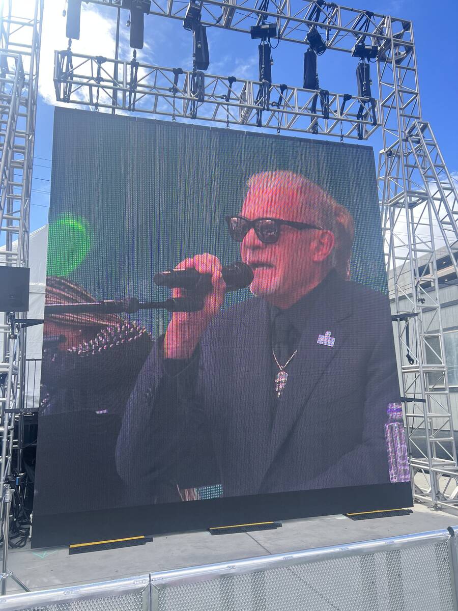 Colts owner Jim Irsay is shown on the big screen at the Jim Irsay Collection memorabilia exhibi ...