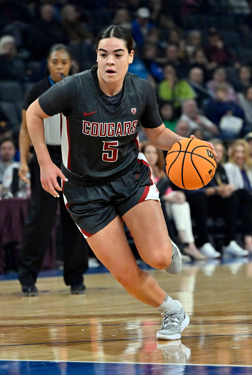 Washington State guard Charlisse Leger-Walker drives the ball against UCLA during the first hal ...