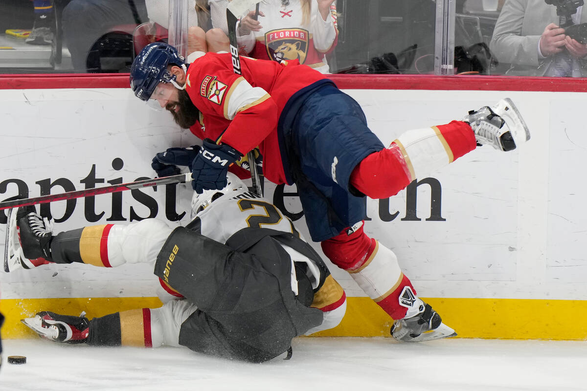 Florida Panthers defenseman Radko Gudas, right, falls on Vegas Golden Knights center Brett Howd ...