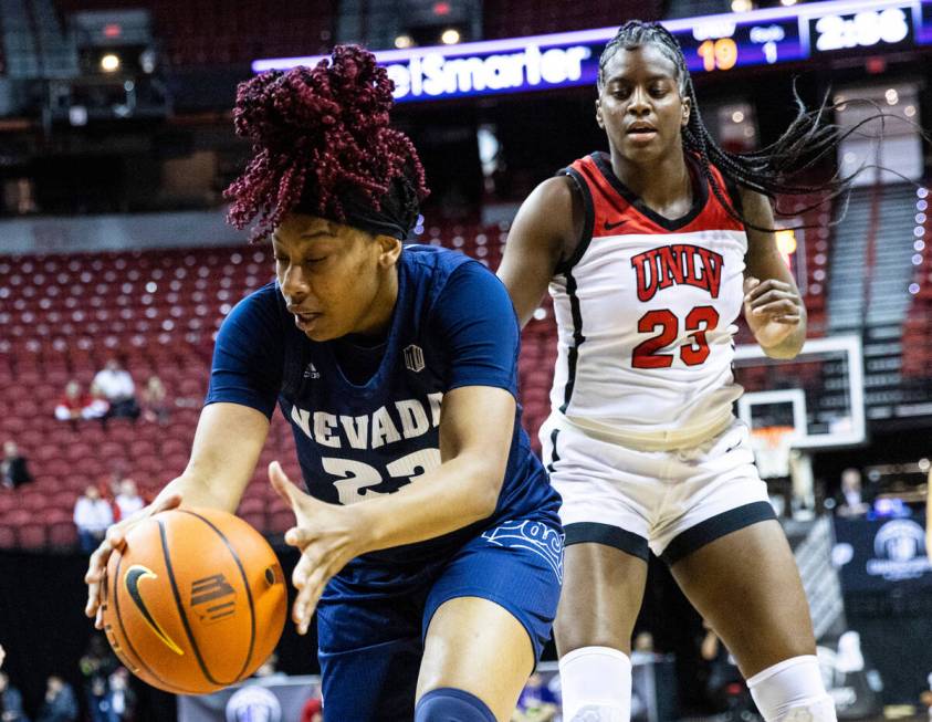 Nevada Wolf Pack forward Lexie Givens (23) recovers a rebound ball as UNLV Lady Rebels center D ...