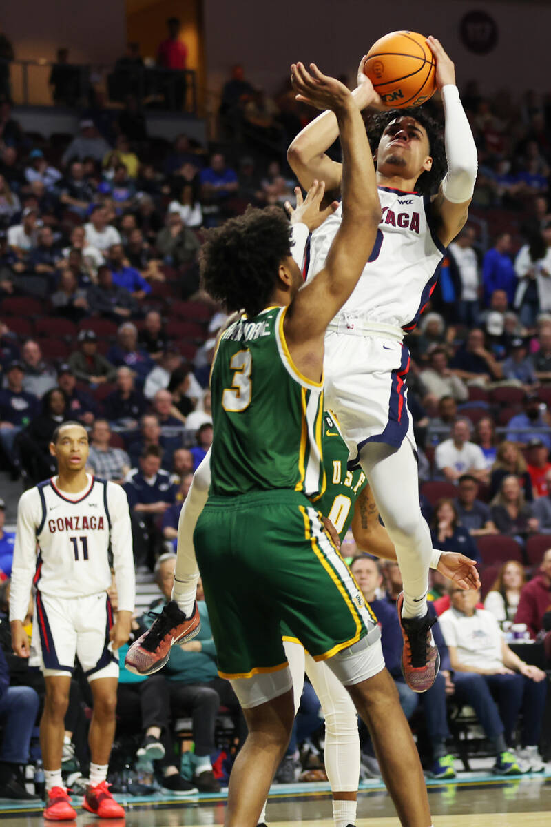 Gonzaga Bulldogs guard Julian Strawther (0) takes a shot under pressure from San Francisco Dons ...