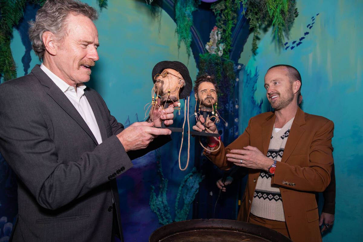 Bryan Cranston and Aaron Paul are shown with their shrunken head at The Golden Tiki on Friday, ...