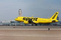 A Spirit Airlines plane arrives at Harry Reid International Airport in Las Vegas on Tuesday, Fe ...