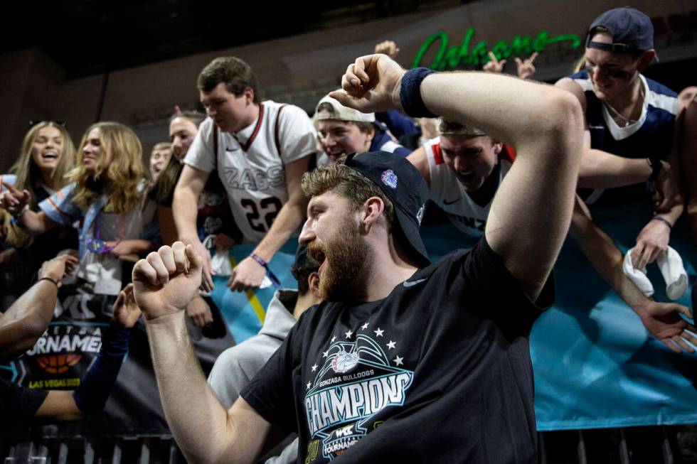 Gonzaga Bulldogs forward Drew Timme celebrates with fans after his team won a West Coast Confer ...