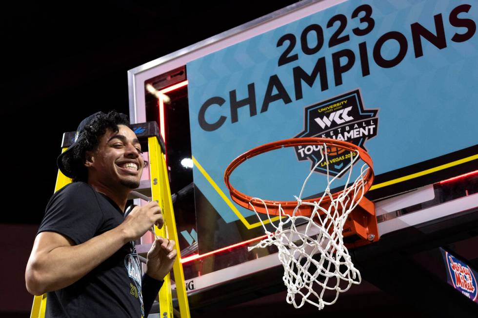 Gonzaga Bulldogs guard Julian Strawther smiles after cutting the net after the Bulldogs won a W ...