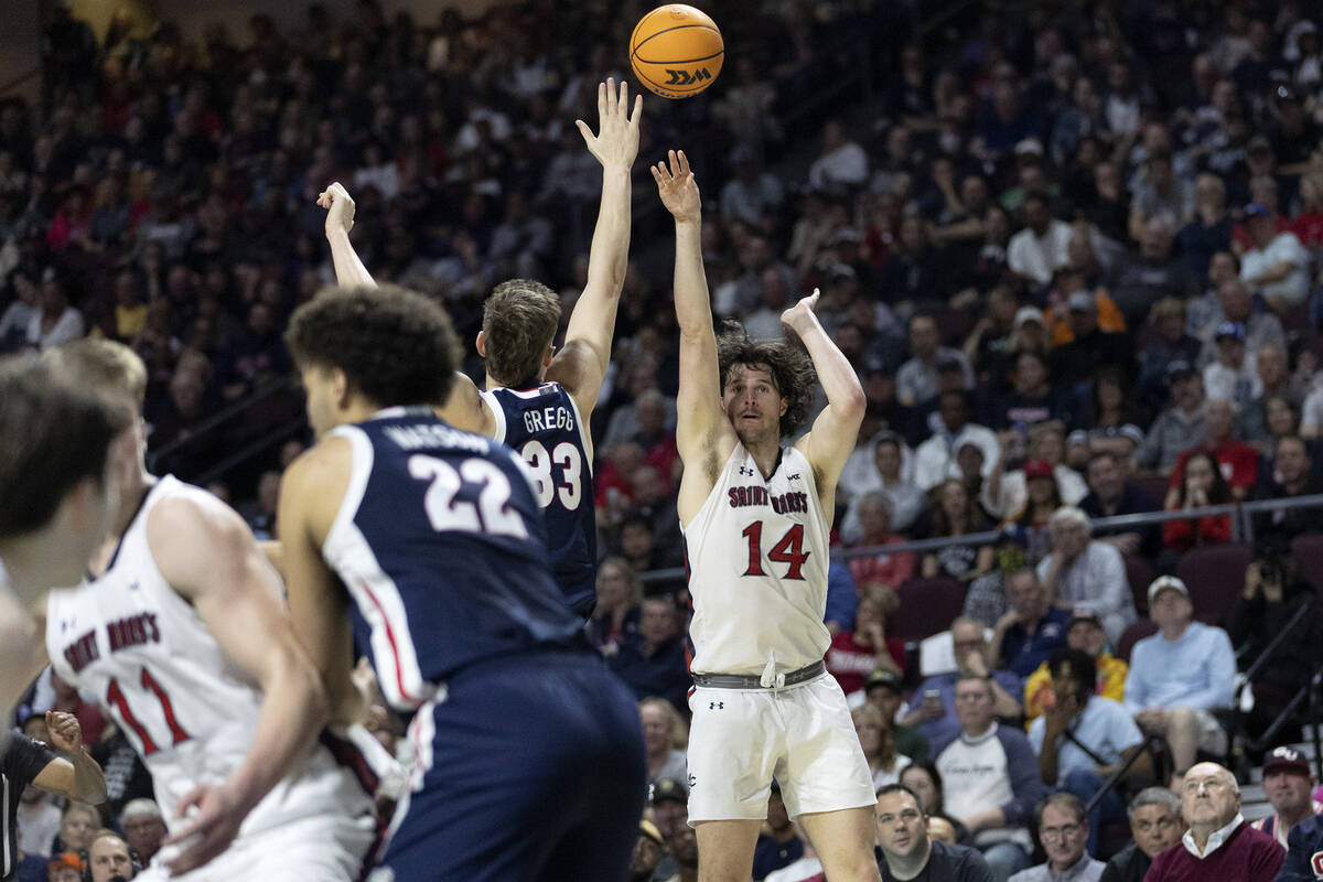 St. Mary's Gaels forward Kyle Bowen (14) shoots against Gonzaga Bulldogs forward Ben Gregg (33) ...