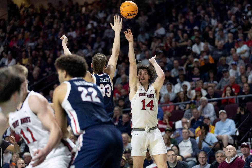 St. Mary's Gaels forward Kyle Bowen (14) shoots against Gonzaga Bulldogs forward Ben Gregg (33) ...