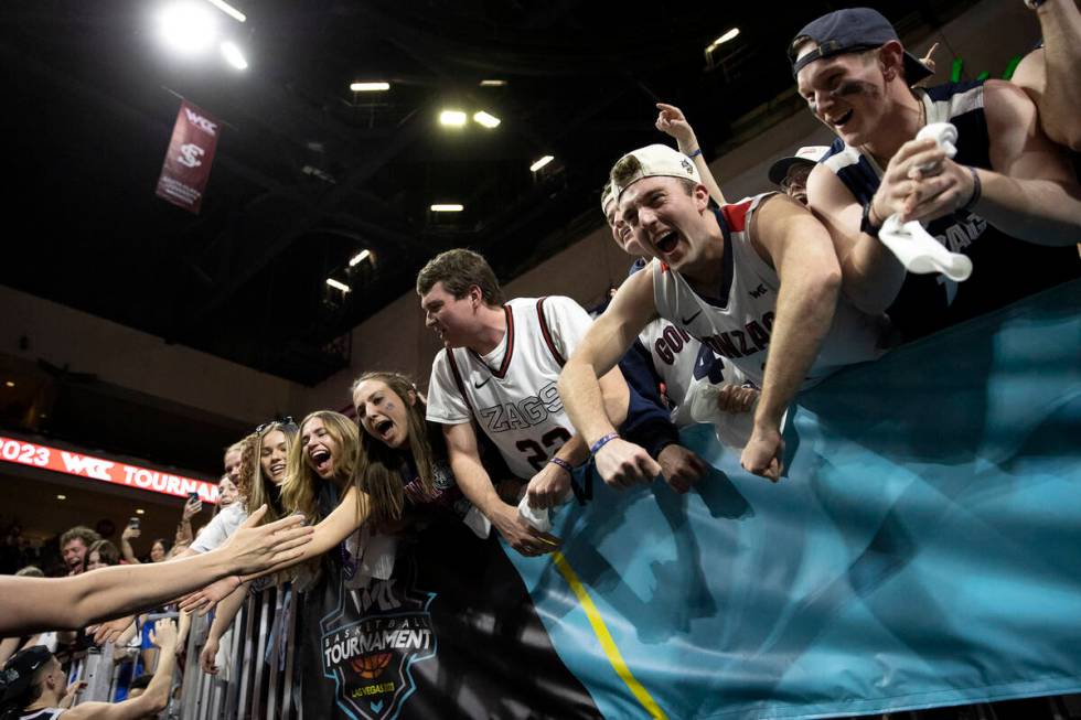 Gonzaga Bulldogs fans greet their team after the Bulldogs won a West Coast Conference men&#x201 ...