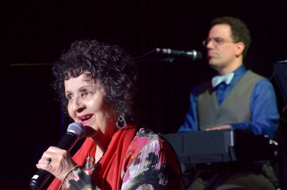 Rita Davidsen sings as her son Kenny Davidsen plays piano at the TSpot Lounge in the Tuscany ho ...