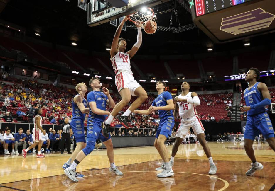 UNLV center David Muoka (12) dunks the ball against Air Force during the first half of a basket ...