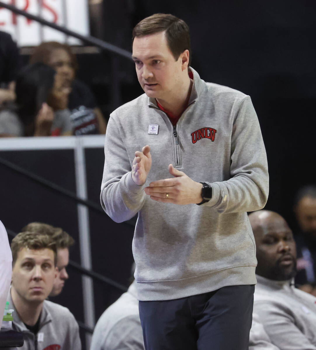 UNLV head coach Kevin Kruger motions to his team during the first half of a basketball game aga ...