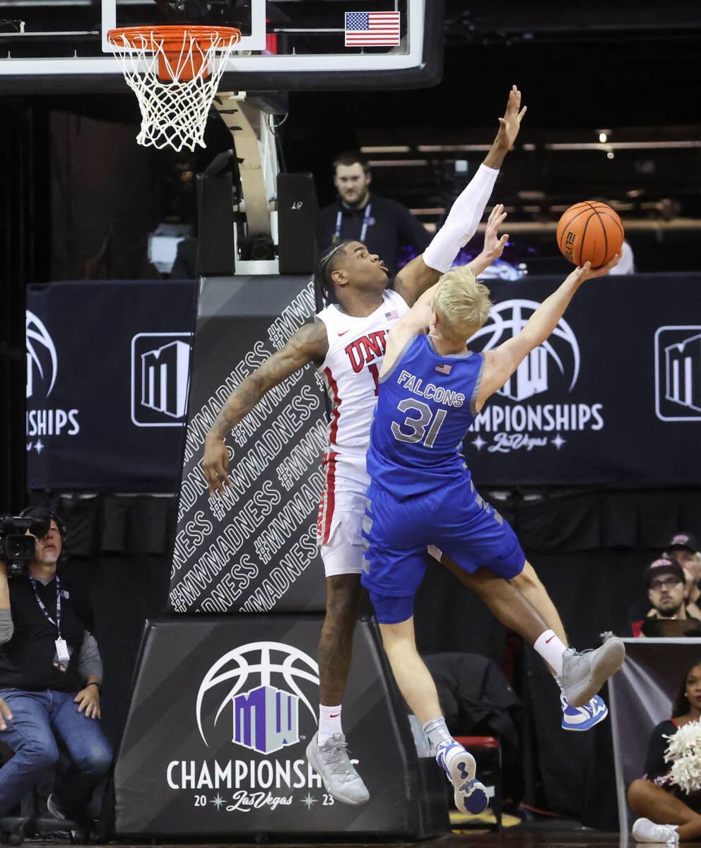 Air Force forward Rytis Petraitis (31) lays up the ball as UNLV guard Luis Rodriguez (15) defen ...